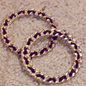 Gold intertwined with black hoop earrings